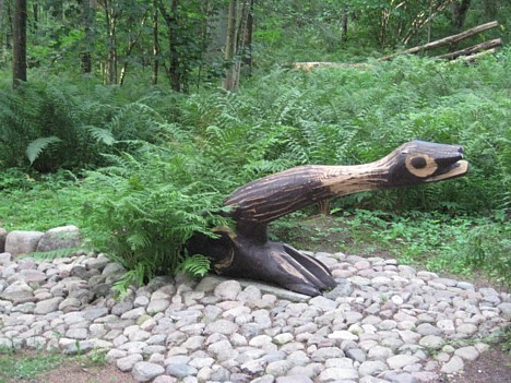 Wooden art decorates the wayside.